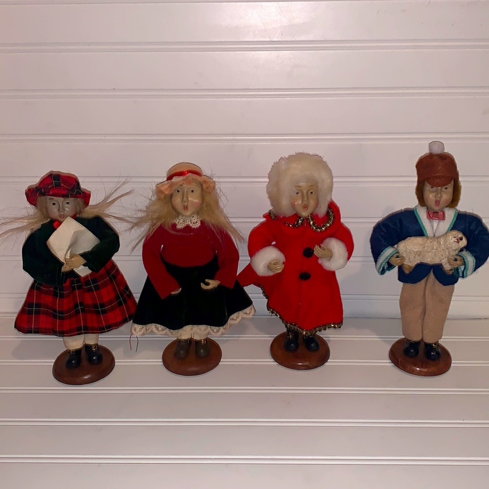 - Holiday Christmas figurines singing Carolers on wooden stands